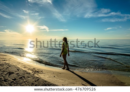 https://thumb9.shutterstock.com/display_pic_with_logo/2326256/476709526/stock-photo-beautiful-woman-on-sunset-beach-walk-in-the-summer-evening-in-last-sun-rays-baltic-sea-poland-476709526.jpg