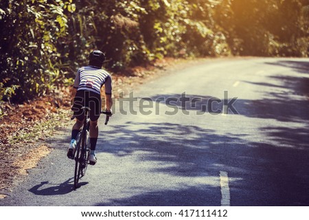 Asian men are cycling road bike in the morning