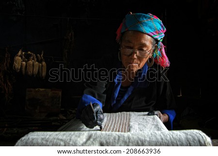 Dien Bien Phu, Dien Bien, Vietnam August 1, 2014: The H'mong ethnic women in the high mountains of decorative painting on canvas, this is one of their traditional occupation.