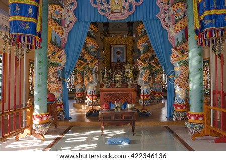 TAY NINH, VIETNAM - APRIL 19, 2016:Portico and altar in the sanctuary inside the Cao Dai Temple, Tay Ninh, Vietnam, Asia