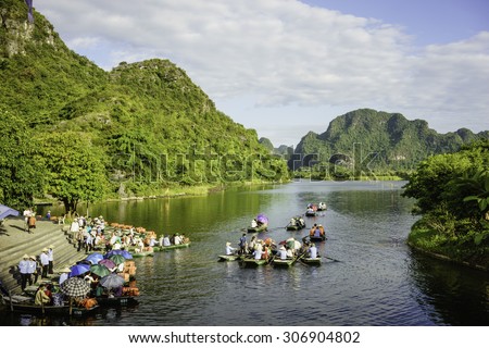 NINH BINH, VIETNAM, JUNE, 28: Unidentified tourists in Trang An on JUNE, 28, 2015. Trang An is the scenic area, ranked special of Vietnam.