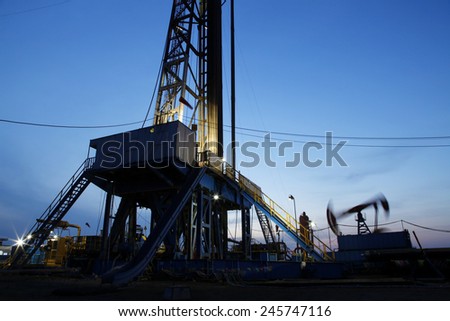 The evening of oilfield derrick silhouette, it is very beautiful