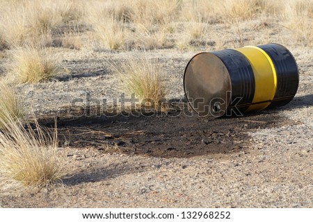 Leaking oil barrel wasting nature