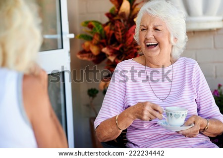 stock-photo-old-friends-laughing-together-and-having-tea-222234442.jpg
