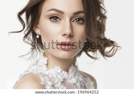Portrait of the bride with big beautiful eyes on white background