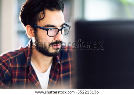 Programmer working at software development company office