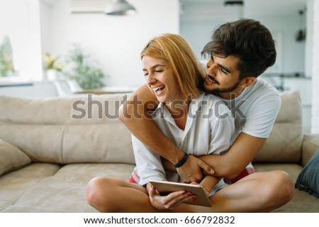 https://thumb9.shutterstock.com/display_pic_with_logo/2418950/666792832/stock-photo-young-attractive-couple-spending-time-together-at-home-666792832.jpg