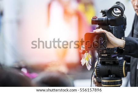 Video camera operator working with his equipment
