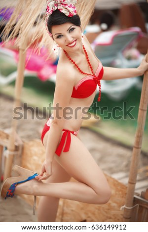 https://thumb9.shutterstock.com/display_pic_with_logo/2457938/636149912/stock-photo-sexy-pin-up-woman-in-red-bikini-retro-style-relaxing-at-beach-at-varadero-happy-beautiful-girl-in-636149912.jpg