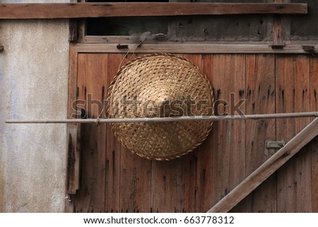 Vietnam conical hat hanging on a wall.