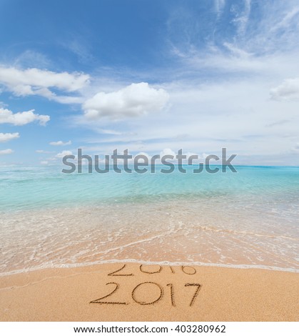 New Year 2017 is coming concept. Happy New Year 2017 replace 2016 concept on the sea beach