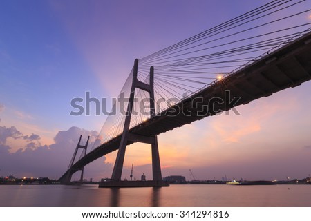 HO CHI MINH city, VIETNAM - AUGUST 12, 2014: Phu My brigde, This is the important bridge linking district 2 and district 7. Photos were taken in sunset, with red sky.