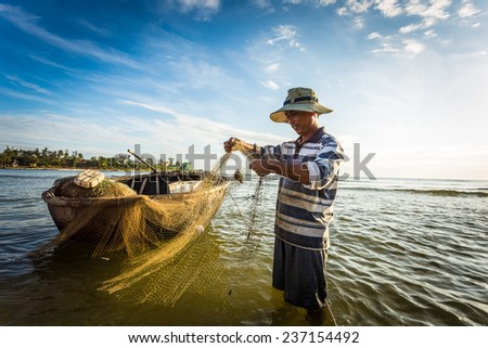 QUANG TRI, VIETNAM - JUNE,10: Fishermen at dawn. JUNE 10, 2014 in QUANG TRI, VIETNAM