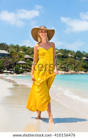 https://thumb9.shutterstock.com/display_pic_with_logo/253693/410156476/stock-photo-carefree-beautiful-fashion-blonde-girl-in-beach-straw-hat-and-long-yellow-dress-flying-in-the-wind-410156476.jpg