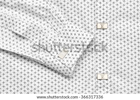 KRIVOY ROG, UKRAINE - NOVEMBER 26, 2015: Buttons on shirt with LOUIS VUITTON logo