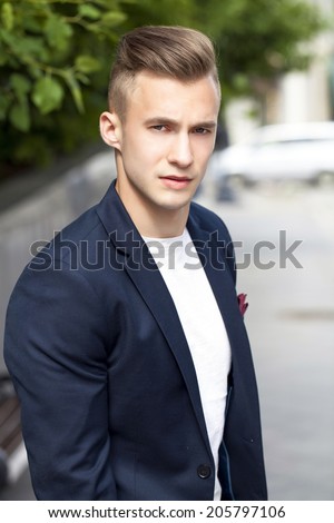 Portrait of young attractive man, outdoors