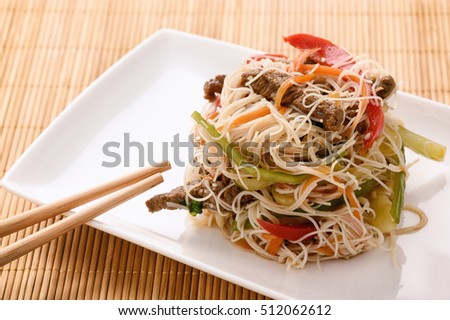 Asian salad with rice noodles, beef and vegetables.