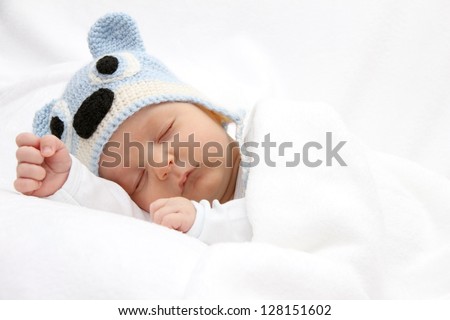 Sleeping baby with knitted hat