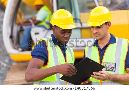 construction co-workers discussing about work plan construction site