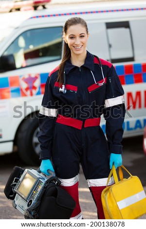 Attractive Female Paramedic Holding Portable Devices Stock Photo ...