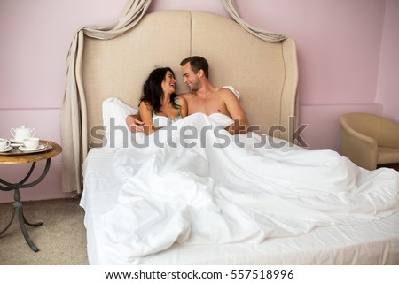 https://thumb9.shutterstock.com/display_pic_with_logo/2710492/557518996/stock-photo-couple-in-bed-smiling-happy-woman-and-man-mood-and-romance-557518996.jpg