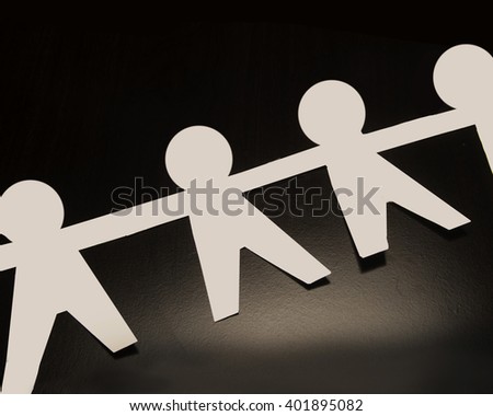 white humanoid figure paper people human shapes cut stock photo