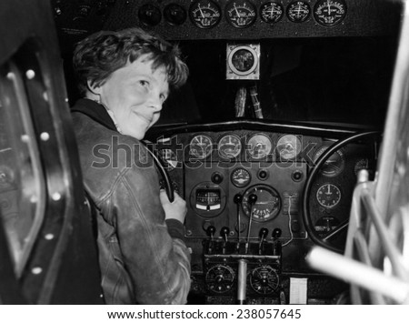 Amelia Earhart in her Lockheed L- 10E Electra prepares for 27,000 mile globe flight, Alameda, ca. 1937,