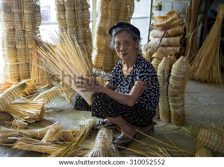 HUNGYEN, VIETNAM - JUNE 21 :Unidentified people weaving bamboo on June 21, 2015 in HungYen, Vietnam. Weaving this tools that used to catch fish is traditional occupation in Hung Yen province.