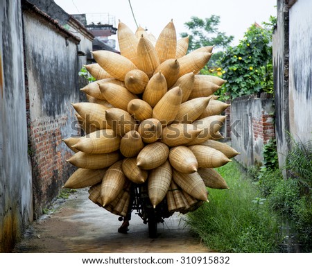 HUNGYEN, VIETNAM - JUNE 21 :Unidentified people weaving bamboo on June 21, 2015 in HungYen, Vietnam. Weaving this tools that used to catch fish is traditional occupation in Hung Yen province.