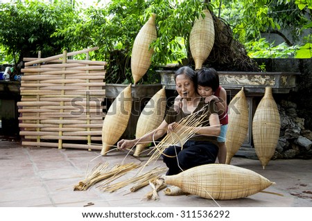 HUNGYEN, VIETNAM - JUNE 21 :Unidentified people weaving bamboo on June 21, 2015 in HungYen, Vietnam. Weaving this tools that used to catch fish is traditional occupation in Hung Yen province.