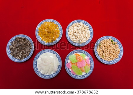 Amazing of Vietnamese food for Tet holiday in spring, jam is traditional food on lunar new year, make from sweet potato, lotus seed, ginger, mango with sugar, colorful background for Vietnam culture