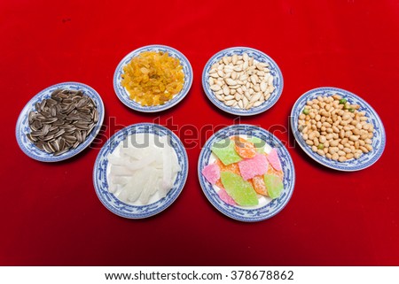 Amazing of Vietnamese food for Tet holiday in spring, jam is traditional food on lunar new year, make from sweet potato, lotus seed, ginger, mango with sugar, colorful background for Vietnam culture