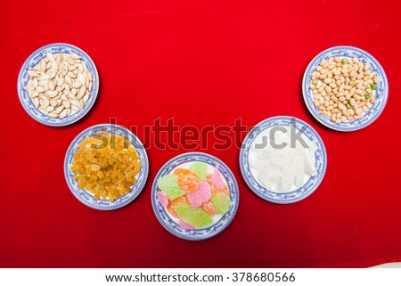 Amazing of Vietnamese food for Tet holiday in spring, jam is traditional food on lunar new year, make from sweet potato, lotus seed, ginger, mango with sugar, colorful background for Vietnam culture