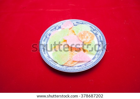 Vietnamese food for Tet holiday in spring, jam is traditional food on lunar new year, can make from sweet potato, lotus seed, ginger with sugar, colorful background for Vietnam custom