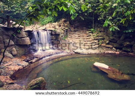 Long exposure image of waterfall in Ecological Tourist Area Thien Son - Suoi Nga, Thien Son - Suoi Nga located in Ba Vi, Vietnam.is a beautiful natural wonder combining mountains, and waterfalls slot