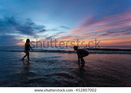 Thanh Hoa, Vietnam , Aug 13 2015 , group of friends splashing water in the sea at samson beach, Thanh Hoa. people and fun