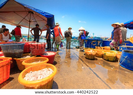 Phu Quoc island, Kien Giang province, Vietnam - May 02, 2016: People's daily life at the fishing village on Phu Quoc island, they collecting fresh fishes from boat and open up a market in the early