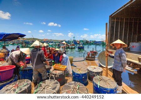 Phu Quoc island, Kien Giang province, Vietnam - May 02, 2016: People's daily life at the fishing village on Phu Quoc island, they collecting fresh fishes from boat and open up a market in the early