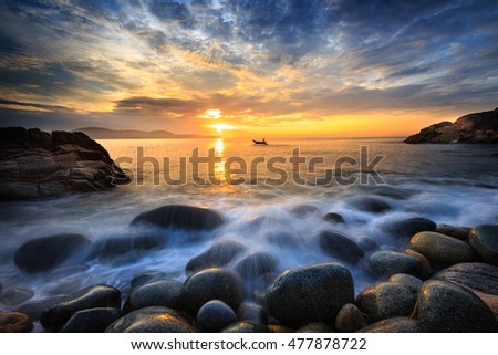 Long exposure of sea and stones, beautiful sunrise in Quy Nhon city, Vietnam