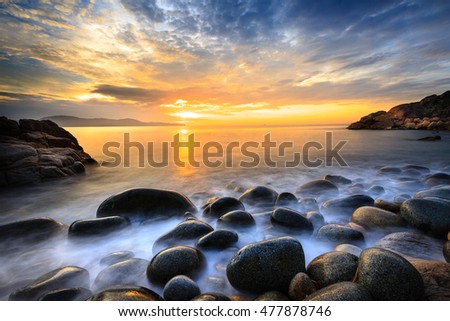 Long exposure of sea and stones, beautiful sunrise in Quy Nhon city, Vietnam