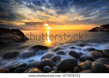 Long exposure of sea and stones, beautiful sunrise in Quy Nhon city, Vietnam