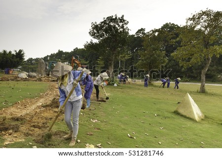 Flamingo Dai Lai, Vinh Phuc province, Vietnam - October 13, 2016 : The female workers who are working with the rudimentary tools at Flamingo Dai Lai resort of Vinh Phuc Province, Vietnam