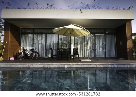 Flamingo Dai Lai, Vinh Phuc province, Vietnam - October 12, 2016 : the living room of a villa overlooking the beautiful pool at Flamingo Dai Lai resort of Vinh Phuc Province, Vietnam