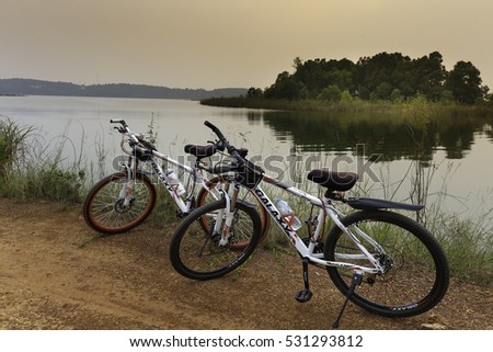 Flamingo Dai Lai, Vinh Phuc, Vietnam - October 10, 2016: Two bicycles beside the lake at sunset