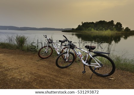 Flamingo Dai Lai, Vinh Phuc, Vietnam - October 10, 2016: Two bicycles beside the lake at sunset