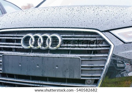 PRAGUE, THE CZECH REPUBLIC, 18.12.2016 - Front mask view of new black car Audi parked in front of Audi dealership.