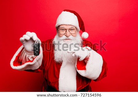 Success, happiness, dream, december, buyer, ownership, property, purchase, rent, sell, truck, cars concept. Funny aged grandfather in red traditional outfit and headwear. X mas noel surprise time!