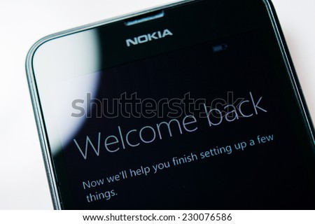LONDON, UNITED KINGDOM - NOVEMBER 9, 2014: Nokia Lumia Windowsphone smartphone display with Welcome Back text. Microsoft has announced that it will stop using Nokia branding