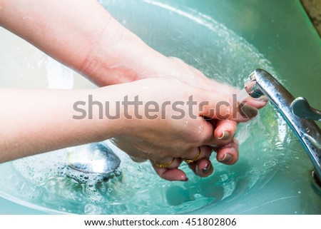 sink tap flow water washing flowing hands under sinks handwashing woman shutterstock