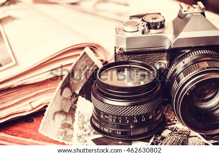 Old retro vintage camera and books photography antique lens equipment black object film photo Old retro vintage camera and books photography antique lens equipment black object film photo